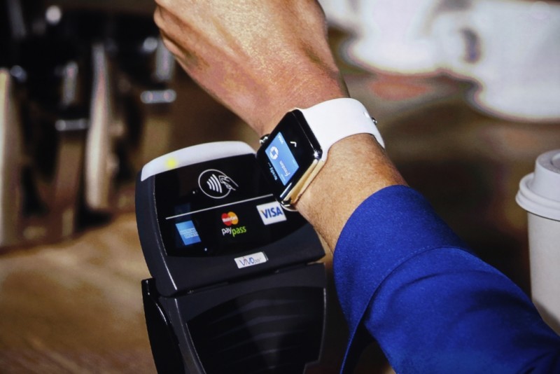 An Apple Watch is shown making a tap transaction during an Apple event at the Flint Center in Cupertino, California, September 9, 2014. REUTERS/Stephen Lam (United States - Tags: SCIENCE TECHNOLOGY BUSINESS)